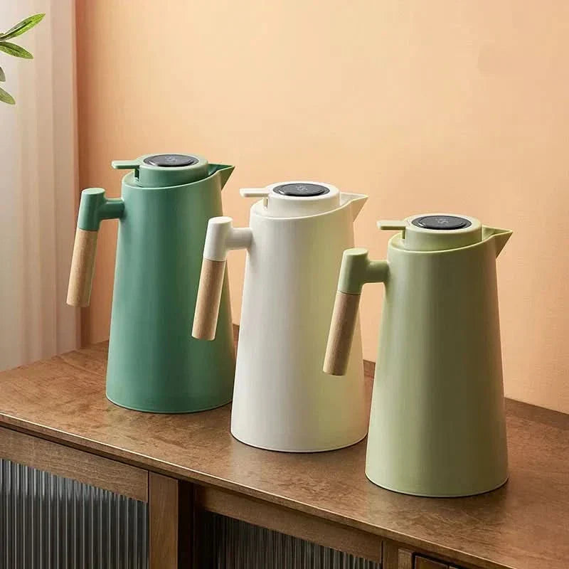 Insulated 1-quart thermal carafe for hot coffee & tea. Features smart temperature display & wood handle.