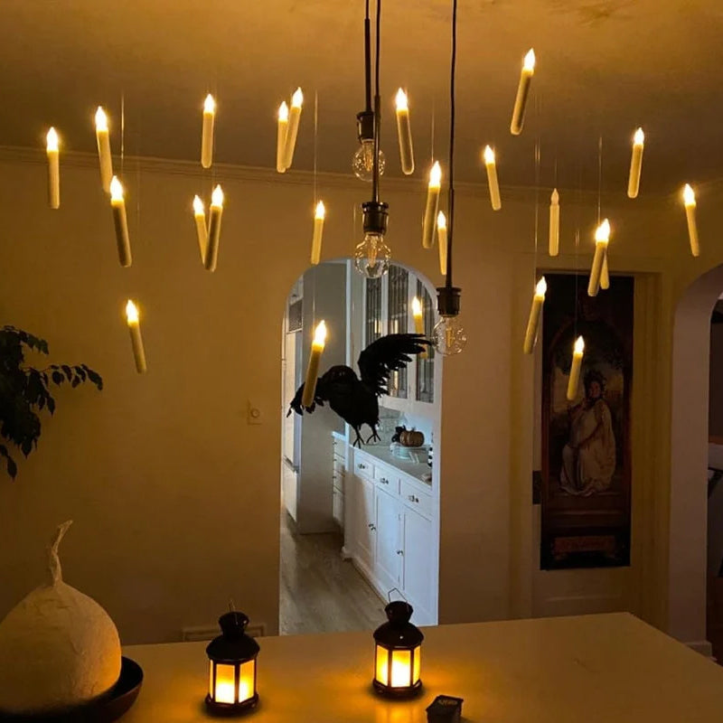 Decorate with ease using this 12-pack of floating LED taper candles and remote wand