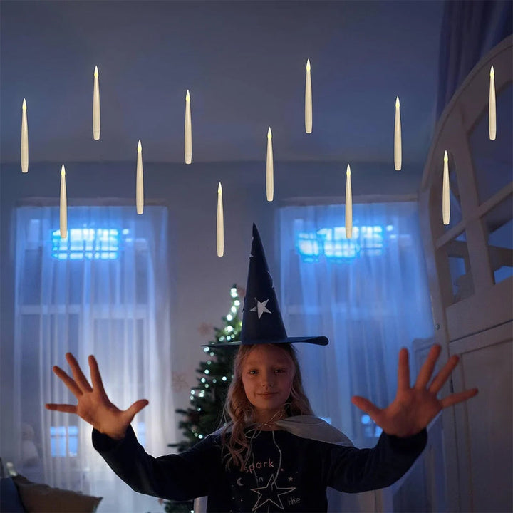 Holiday lighting featuring floating LED taper candles, controlled by an included remote wand