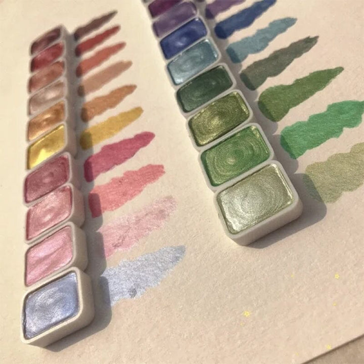 Swatch card displaying the shimmering effects of the 20-color metallic watercolor set, essential painting supplies.