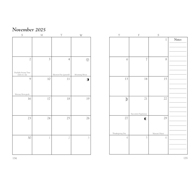 Witch's hand holding open the 2025 Witches' Datebook, a magical planner and journal