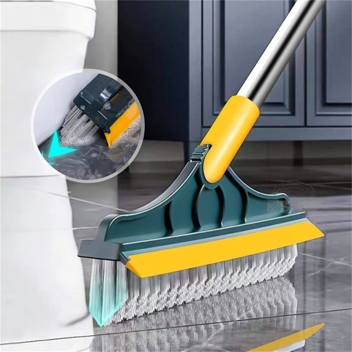 2-in-1 floor scrub brush with V-shaped bristles, rotating head, and rubber scraper for versatile cleaning of corners and surf
