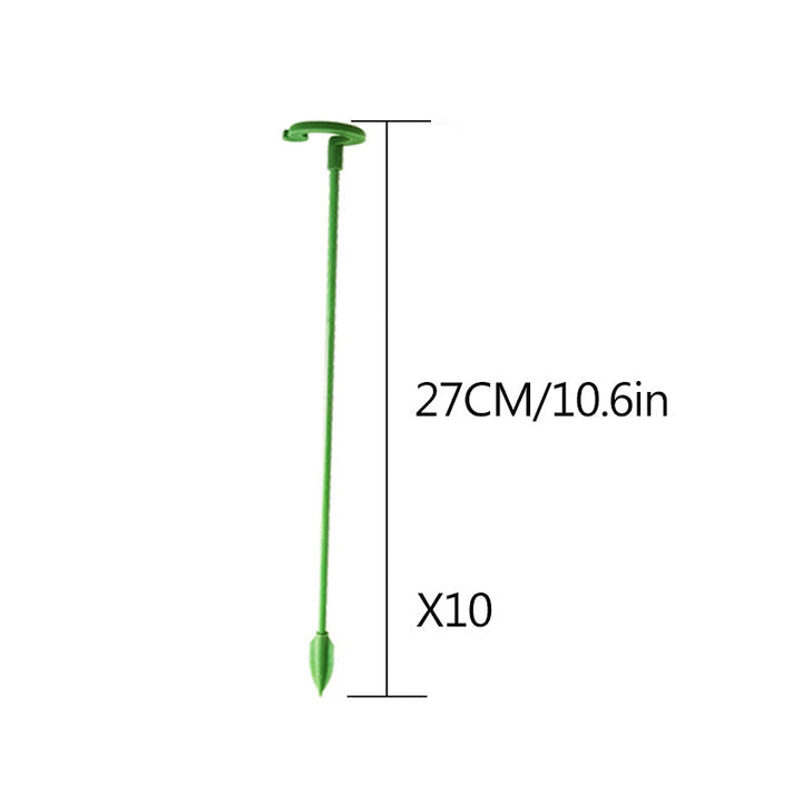 User actively adjusting a plant support stake to perfectly brace a tall garden plant