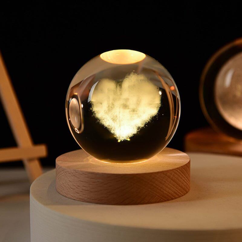 Night light with intricate 3D design inside a crystal ball, wood base included