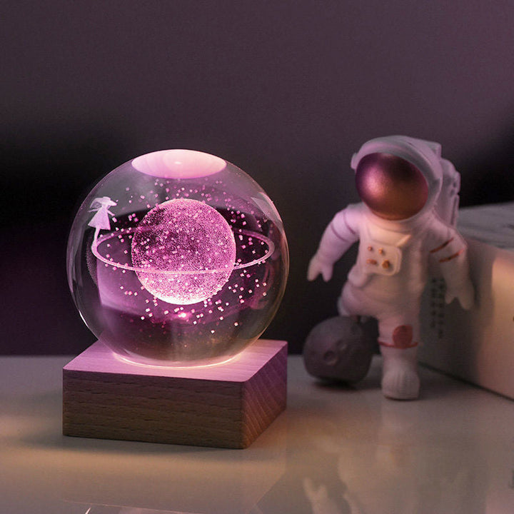 Crystal sphere night light with a detailed 3D engraved galaxy, a beautiful and functional piece of art