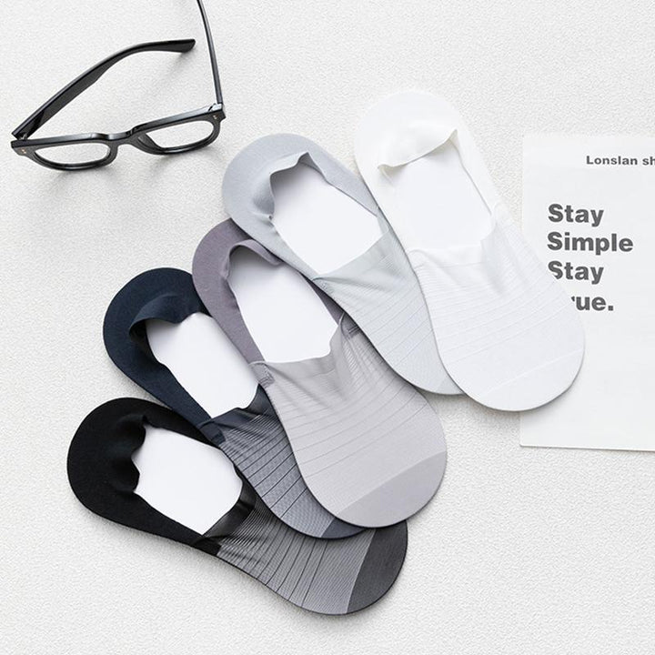 A hand holding up a lightweight ice silk ankle sock, emphasizing its breathable and cool properties