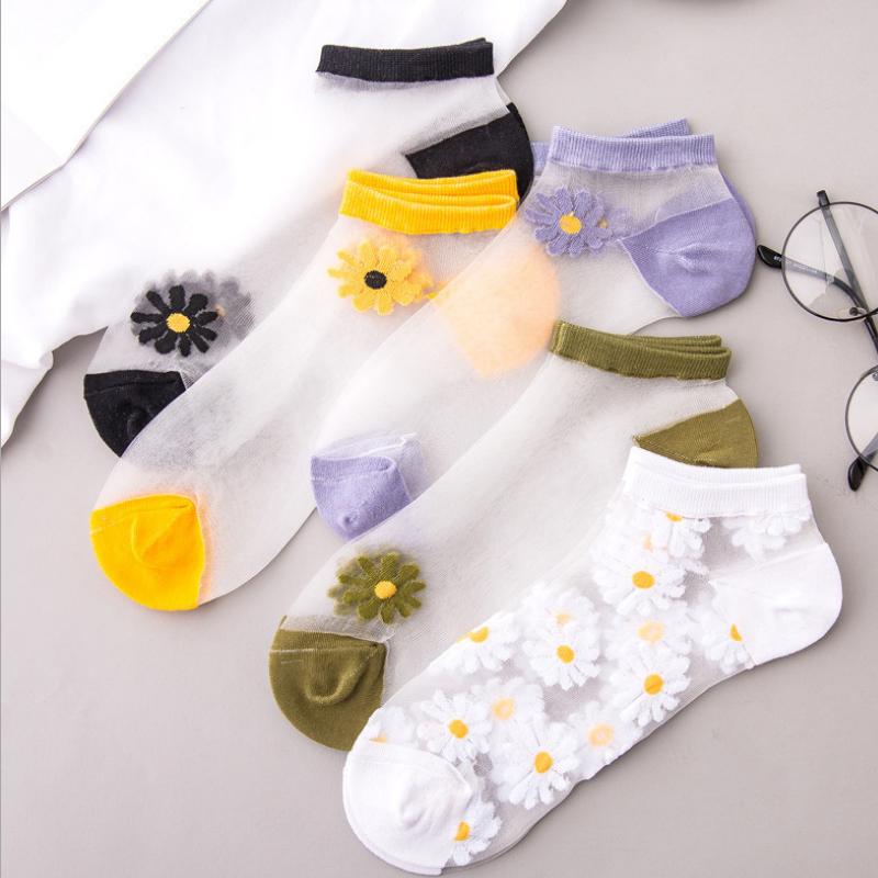 Stack of colorful women's floral daisy ankle socks in various shades