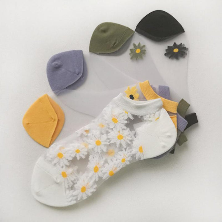 Five pairs of women's ankle socks with unique daisy and floral designs, soft cotton material