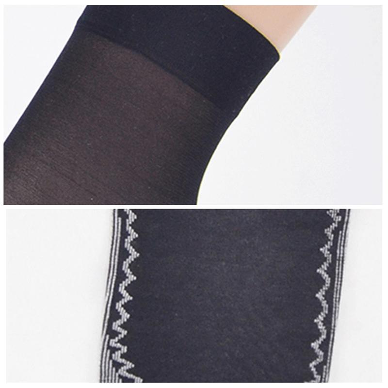 Stack of folded women's silky socks, showcasing the soft texture and variety for daily use