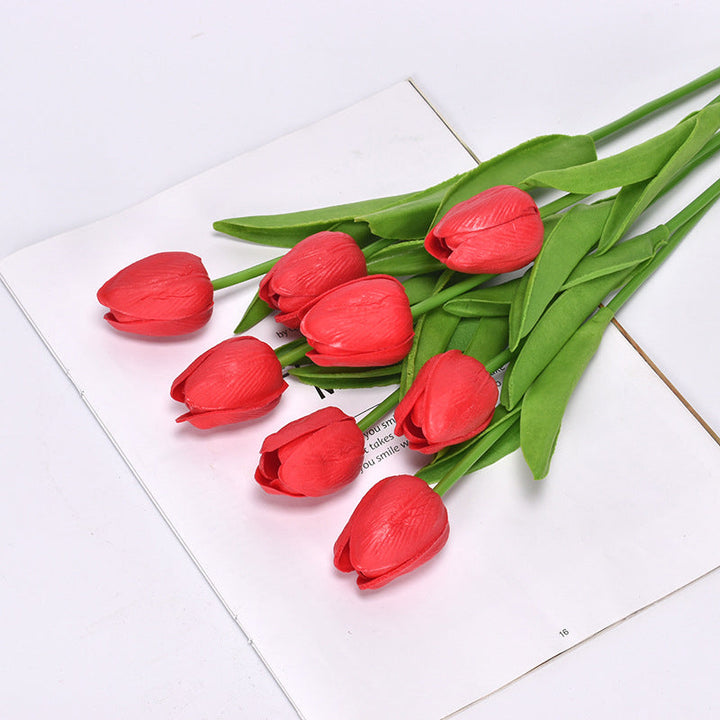 Seven realistic artificial tulips arranged in a tabletop display, a perfect home accent