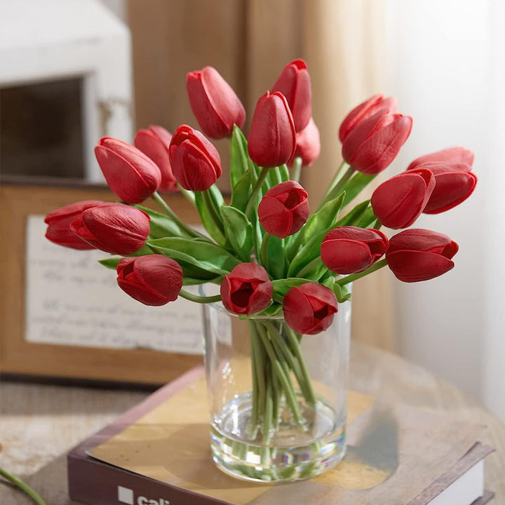 Assorted artificial tulips in a stylish vase, enhancing living room or office decor