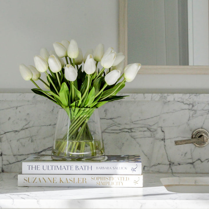 Outdoor garden setting with durable artificial tulips, adding a pop of color