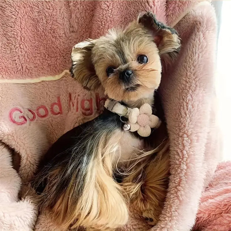 "Adjustable cat collar with floral pattern and bell, featuring earth tones and pastels for style and comfort."