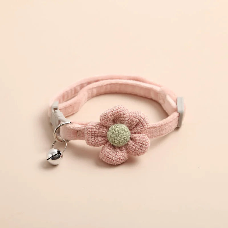 "Adjustable cat collar with floral pattern and bell, featuring earth tones and pastels for style and comfort."
