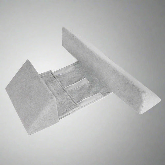 Anti-Roll Adjustable Memory Foam Baby Pillow in Pink, side-sleeper support, gentle and breathable design for newborns.