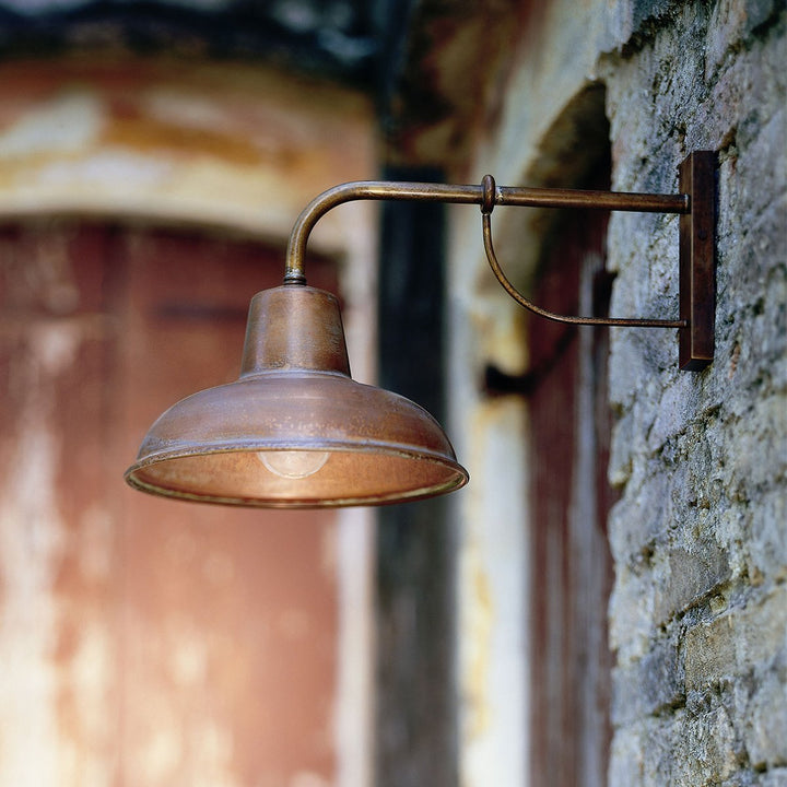 Antique copper wall lamp with aged finish, bell-shaped shade, perfect for indoor/outdoor use, E27 lighting option.