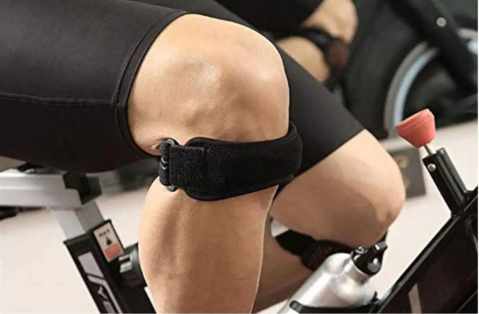 "Black adjustable patella knee strap for pain relief, providing targeted compression and support for athletes and fitness ent