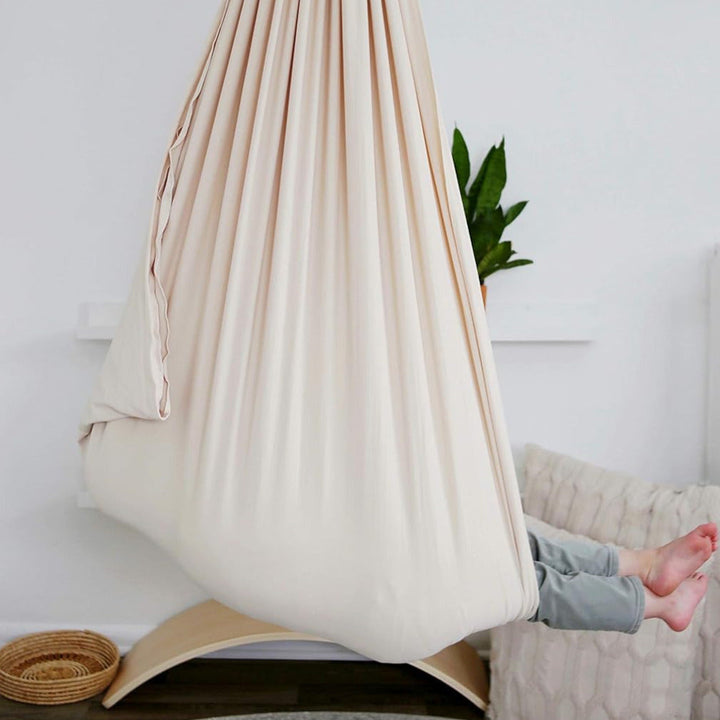 "Calming therapy hammock for children in soothing colors, enhances relaxation, emotional calmness, and motor skills."