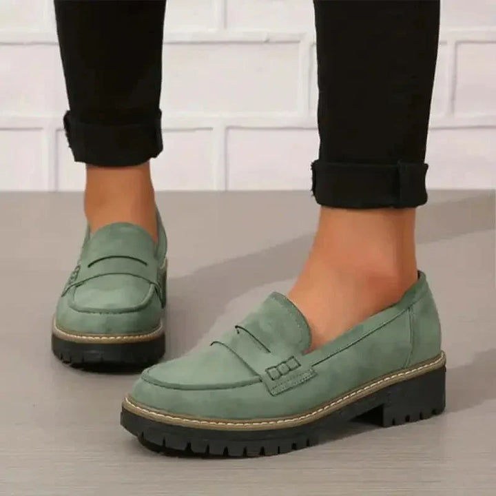 "Comfortable women's slip-on suede sandals showcasing soft suede texture and supportive sole for stylish all-day wear."