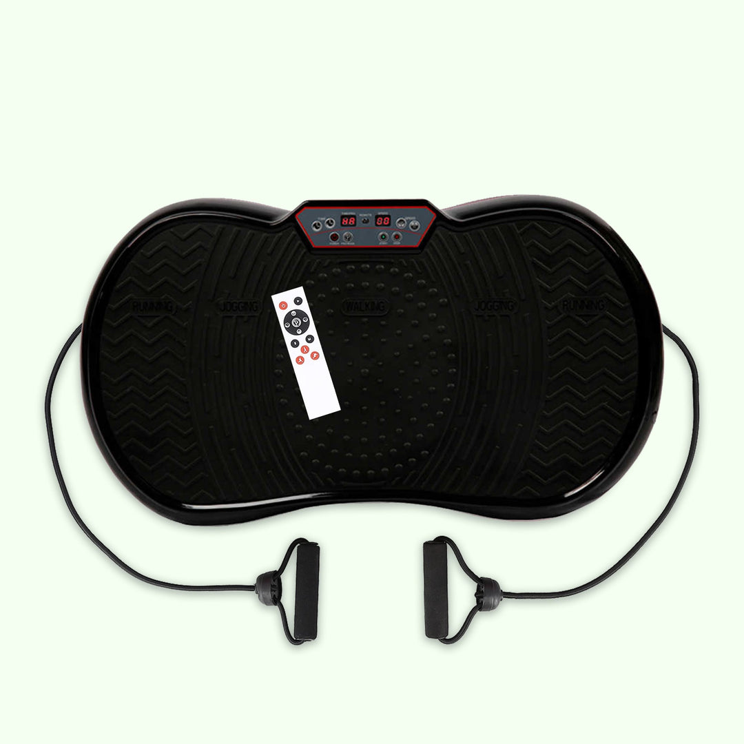 Compact home vibration exercise platform in black with detachable resistance bands, non-slip surface, and remote control.