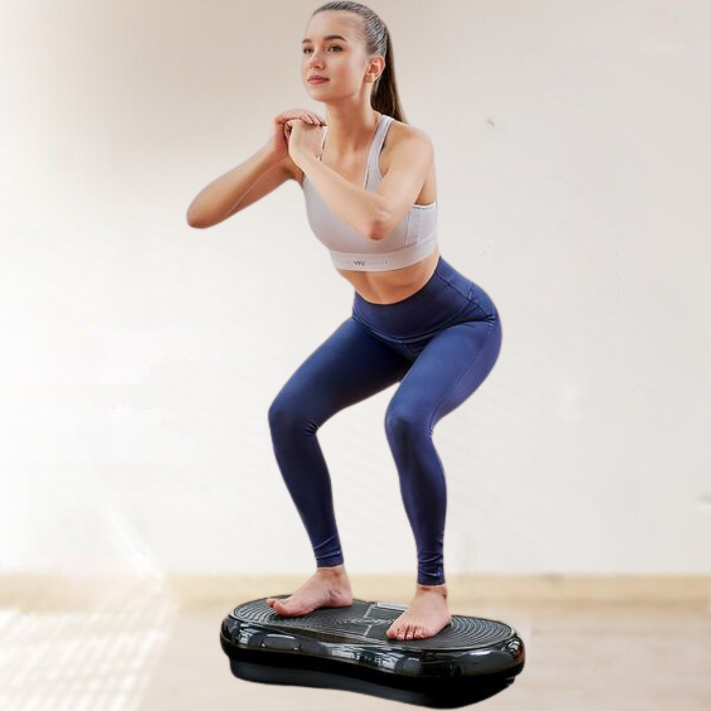 Compact home vibration exercise platform in black with detachable resistance bands, non-slip surface, and remote control.