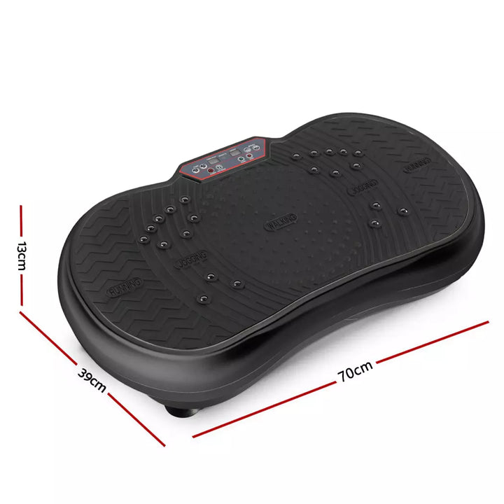 Compact home vibration exercise platform in black with detachable resistance bands, non-slip surface, and remote control.