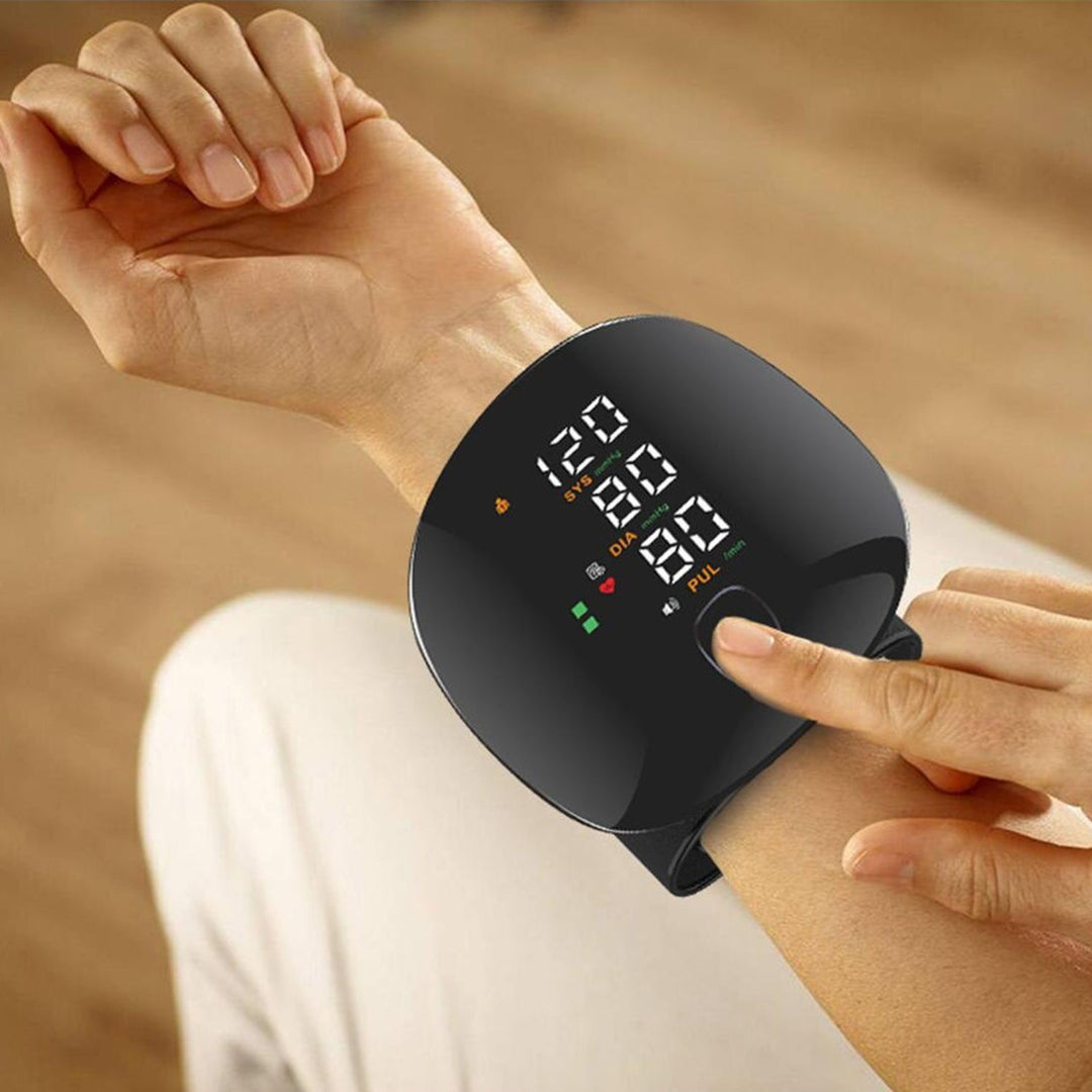 Compact smart wrist blood pressure monitor with a large LCD, sleek design, precise readings, ideal for health tracking.