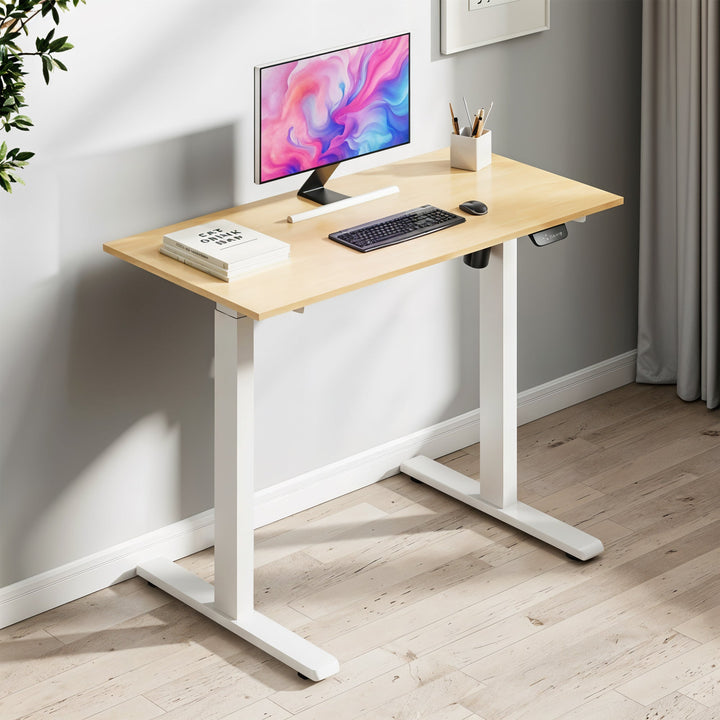 "Electric height adjustable sit-stand computer desk with spacious surface for ergonomic home or office use."