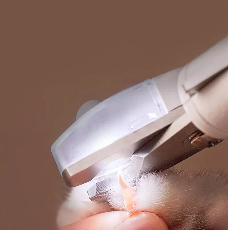 "Electronic claw trimmer for pets with ergonomic handle, designed for precise and gentle claw grooming for dogs and cats."