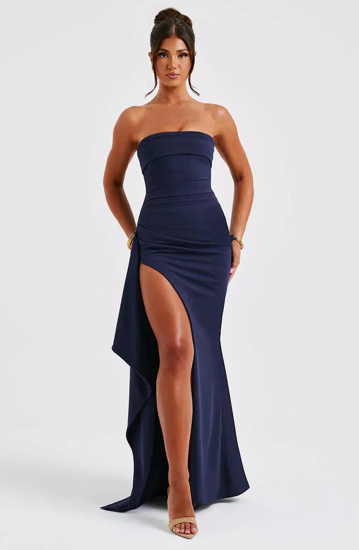 "Elegant off-shoulder twisted navy maxi dress with fluid silhouette, perfect for evening wear and special occasions."