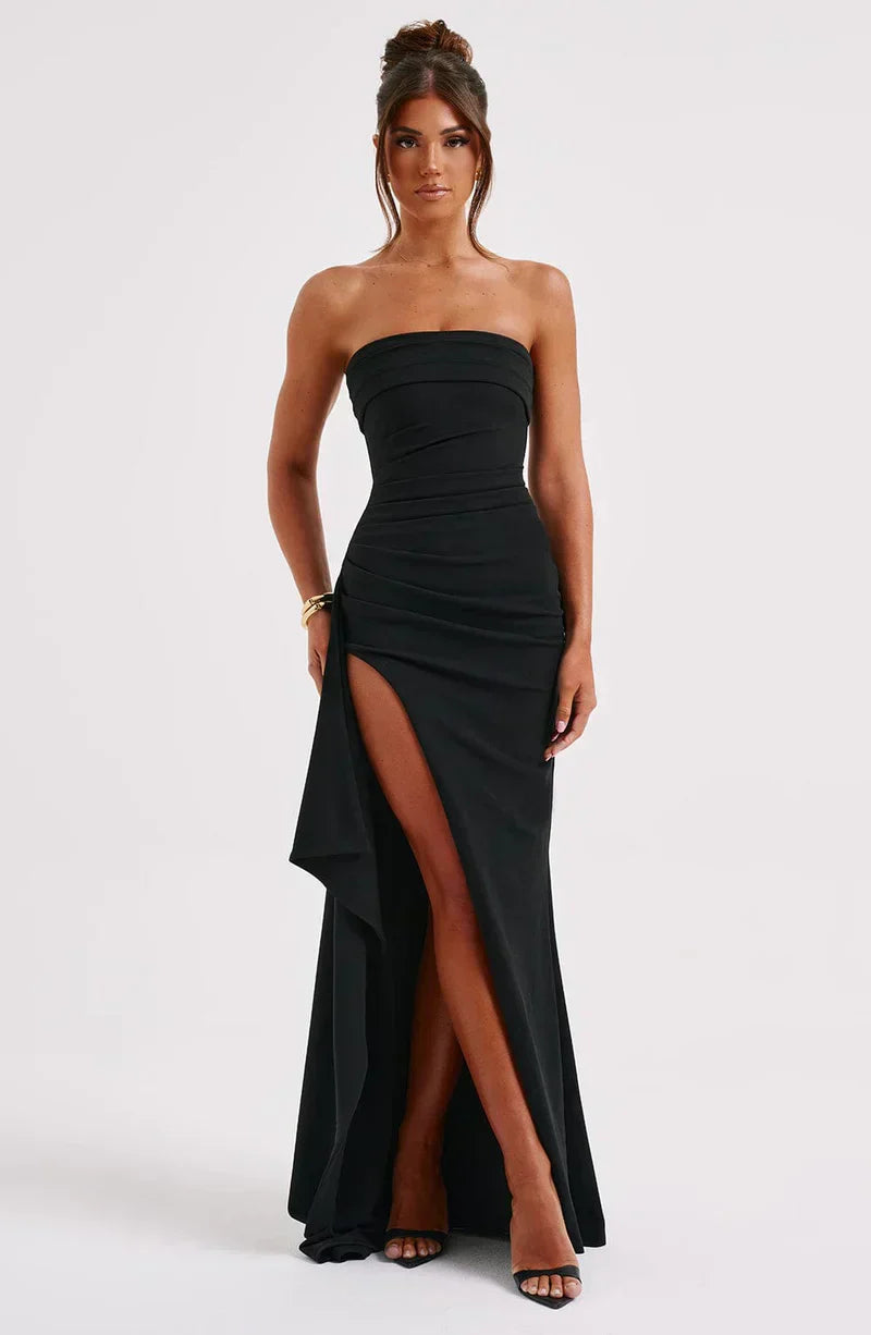 "Elegant off-shoulder twisted navy maxi dress with fluid silhouette, perfect for evening wear and special occasions."