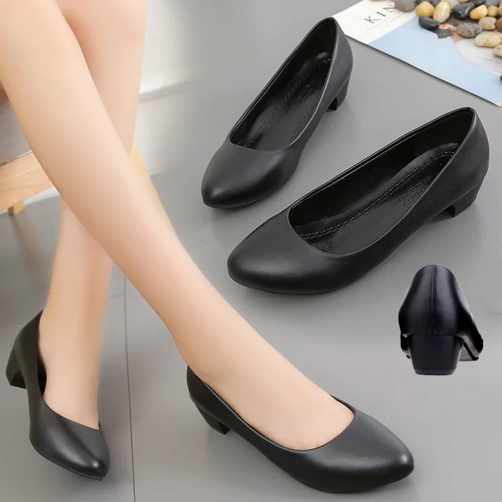 "Elegant orthopedic black women's pumps, sleek design with cushioned support for style and comfort."