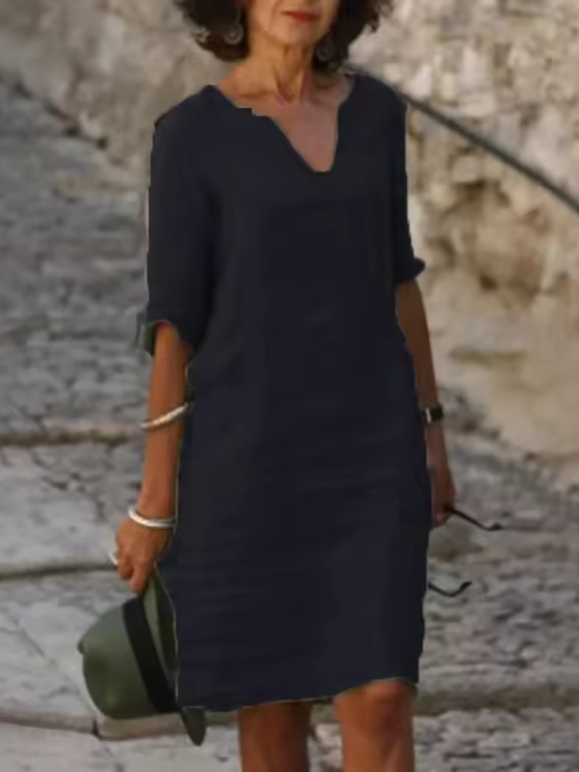 Elegant slim fit V-neck cotton linen dress with mid sleeves, perfect for warm weather. Shop women's dresses for all occasions