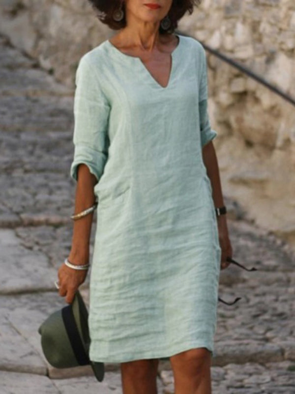 Elegant slim fit V-neck cotton linen dress with mid sleeves, perfect for warm weather. Shop women's dresses for all occasions