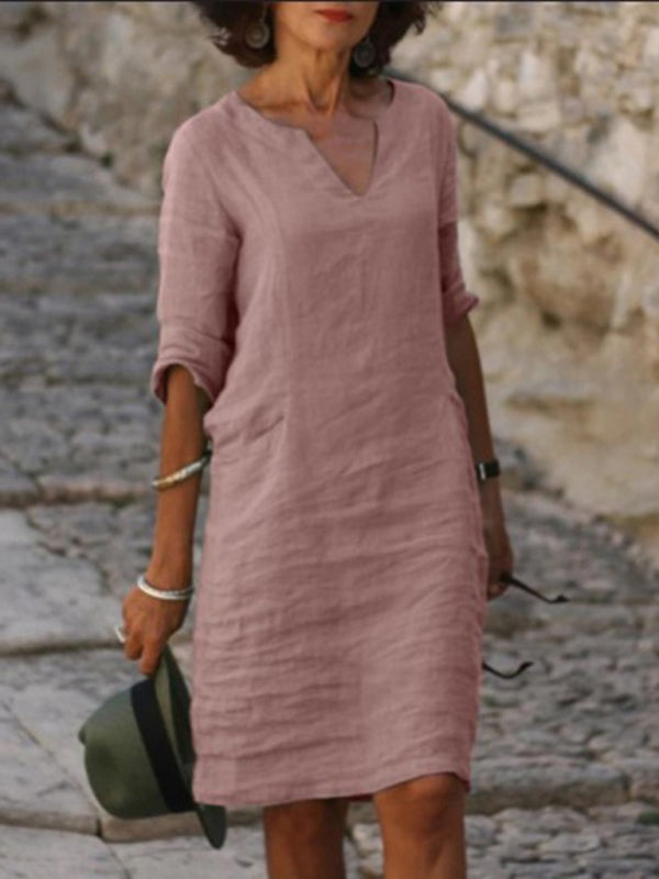 Elegant slim fit V-neck cotton linen dress with mid sleeves, perfect for warm weather. Shop women's dresses for all occasions