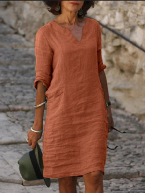 Elegant slim fit V-neck cotton linen dress with mid sleeves, perfect for warm weather. Shop women's dresses for all occasions