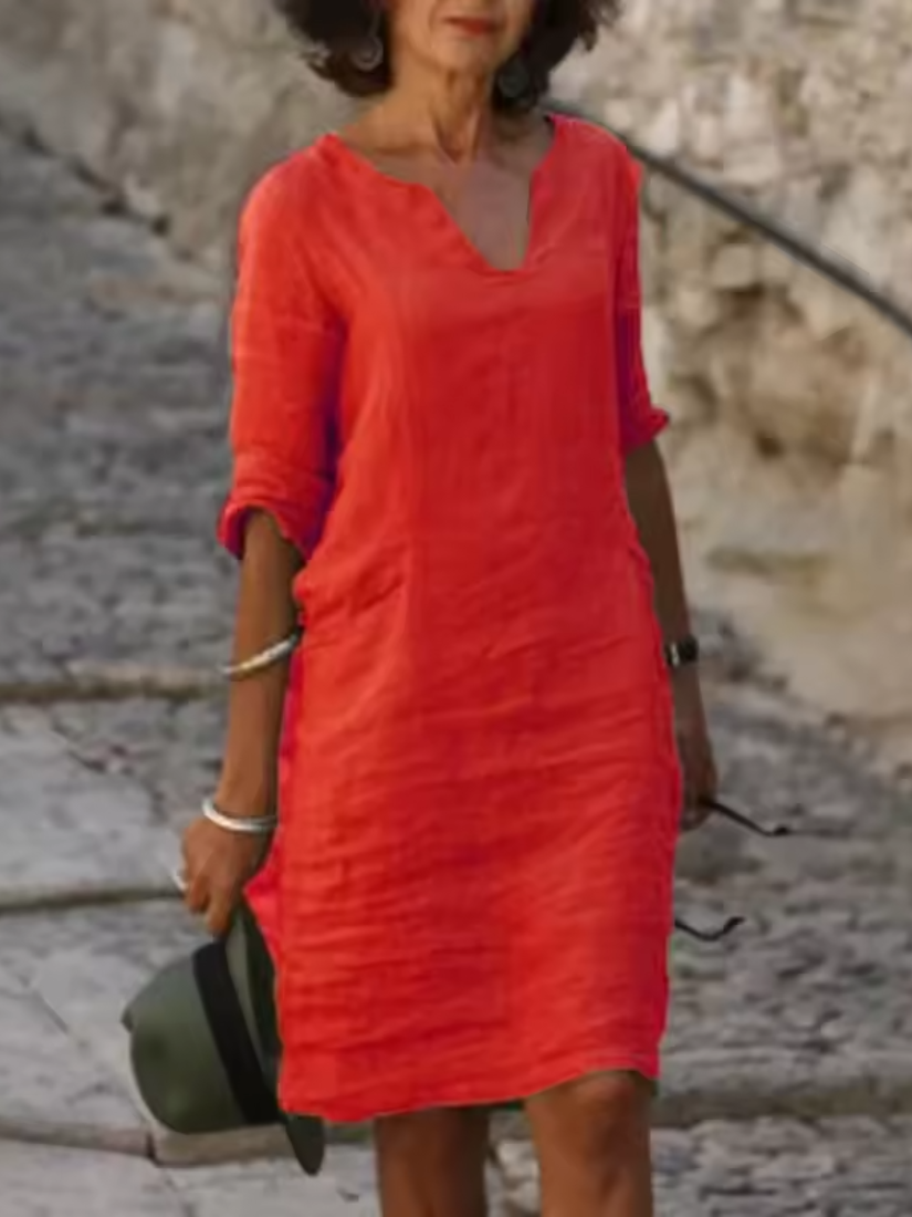 Elegant slim fit V-neck cotton linen dress with mid sleeves, perfect for warm weather. Shop women's dresses for all occasions
