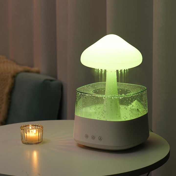 "Elegant white humidifier with wooden finish, emits soothing mist and rain sounds for relaxation and improved sleep."