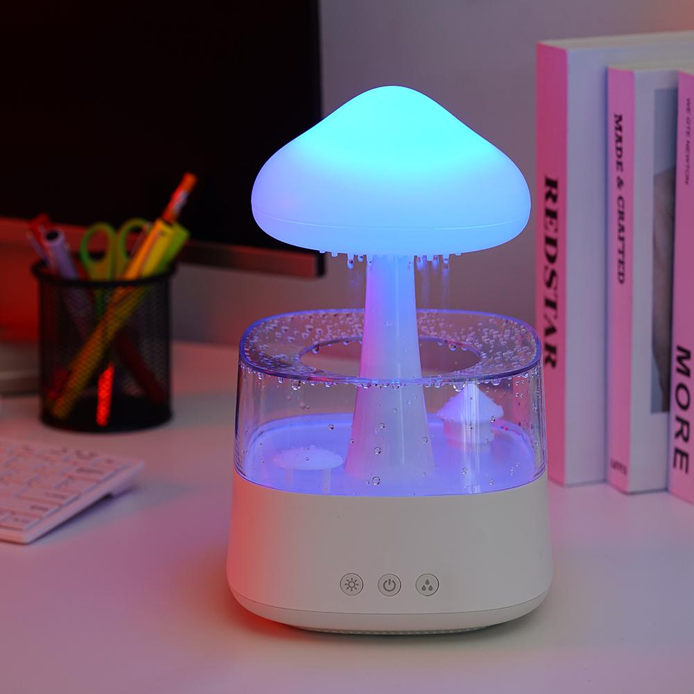 "Elegant white humidifier with wooden finish, emits soothing mist and rain sounds for relaxation and improved sleep."