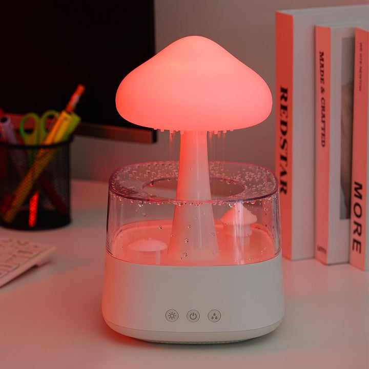 "Elegant white humidifier with wooden finish, emits soothing mist and rain sounds for relaxation and improved sleep."