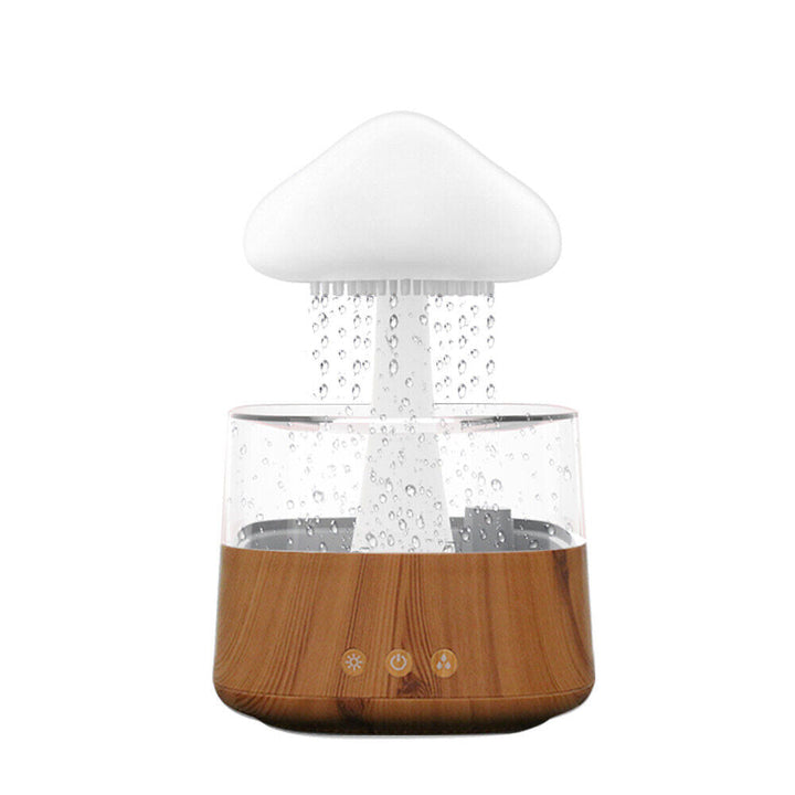 "Elegant white humidifier with wooden finish, emits soothing mist and rain sounds for relaxation and improved sleep."
