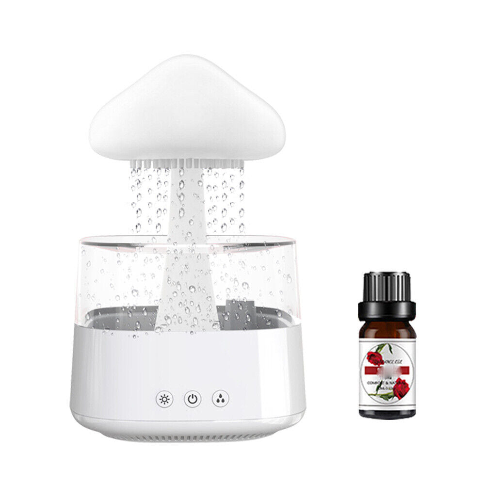 "Elegant white humidifier with wooden finish, emits soothing mist and rain sounds for relaxation and improved sleep."