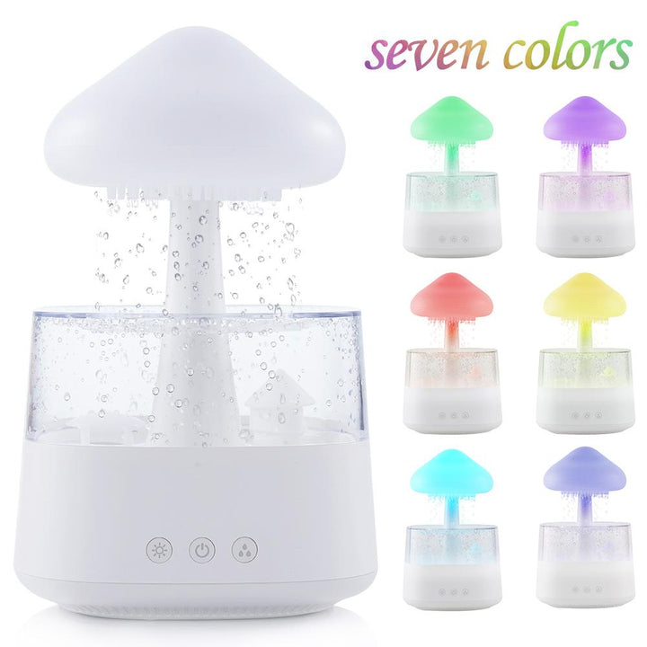 "Elegant white humidifier with wooden finish, emits soothing mist and rain sounds for relaxation and improved sleep."