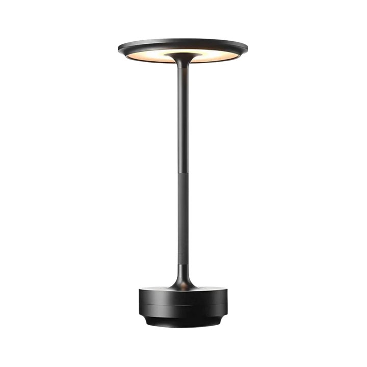 "Elegant wireless table lamp with sleek curves, gold finish; perfect for versatile ambient lighting on any table or desk."