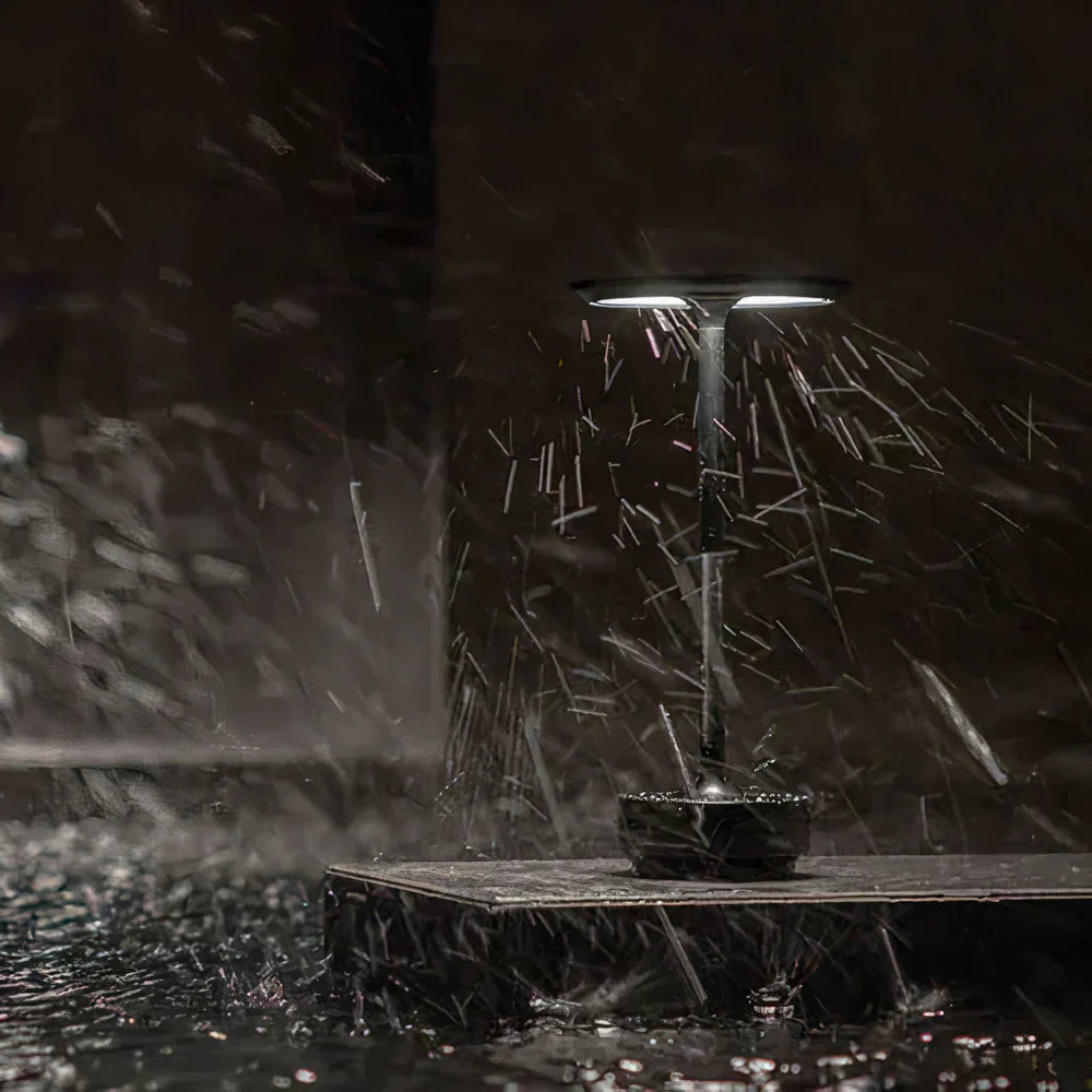 "Elegant wireless table lamp with sleek curves, gold finish; perfect for versatile ambient lighting on any table or desk."