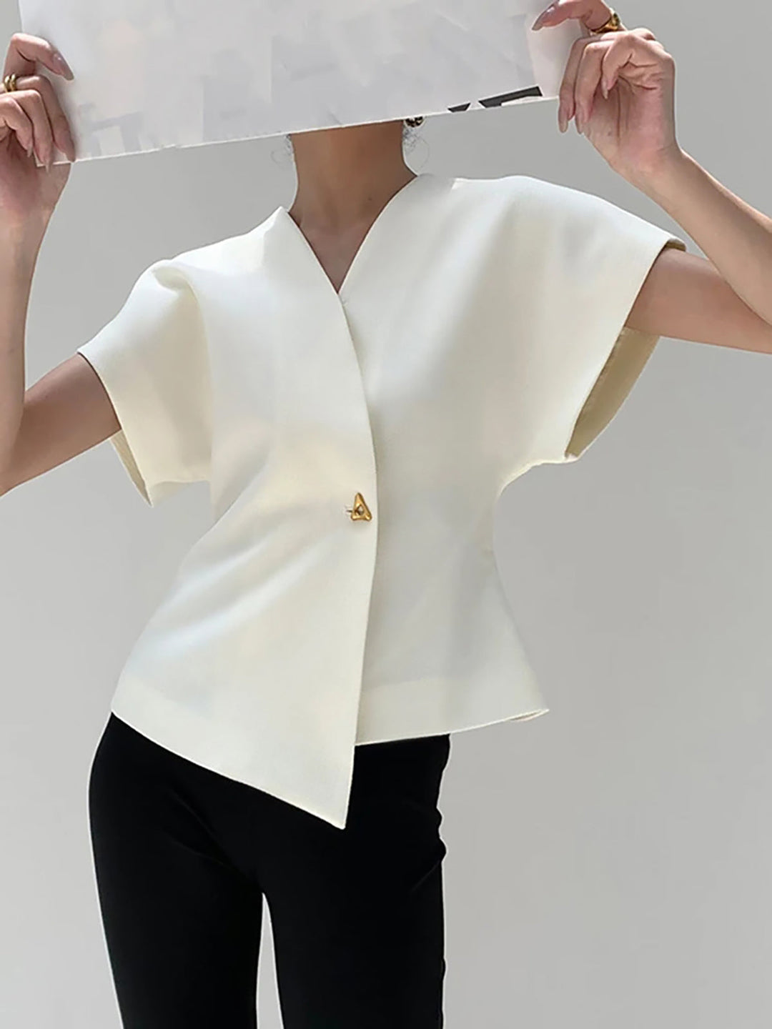 "Elegant women's V-neck blouse with buttons, tailored fit, chic button-down design, ideal for versatile stylish outfits."