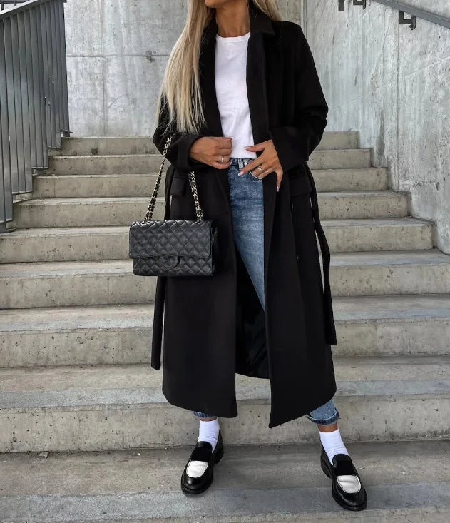 "Elegant women's mid-length coat with button closure, ideal for cool weather and versatile for casual or dressy occasions."