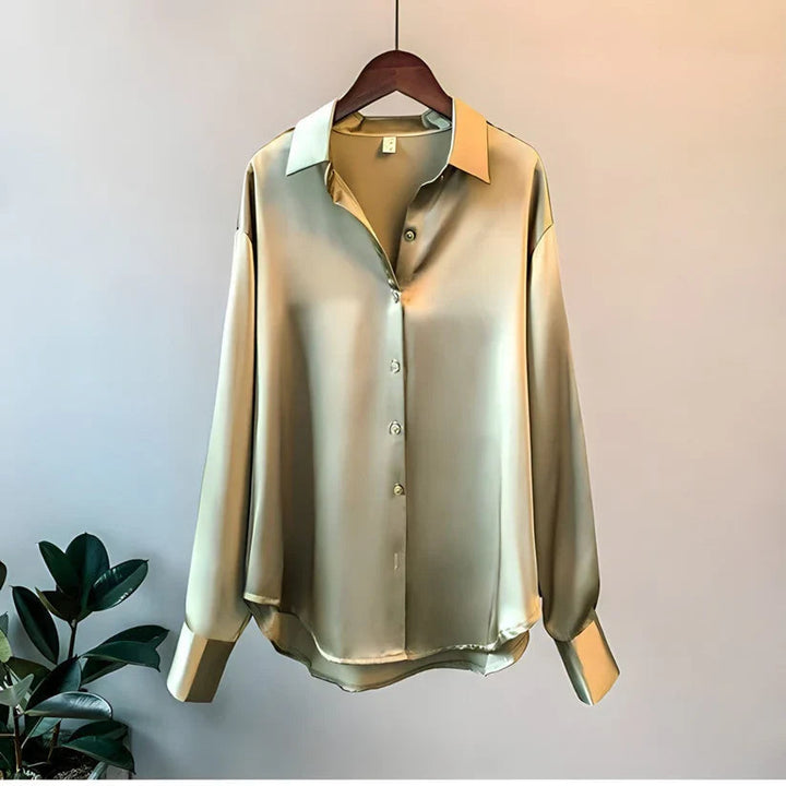 Elegant women's silk blouse with smooth texture; lightweight, versatile design in multiple colors. Perfect for any occasion.