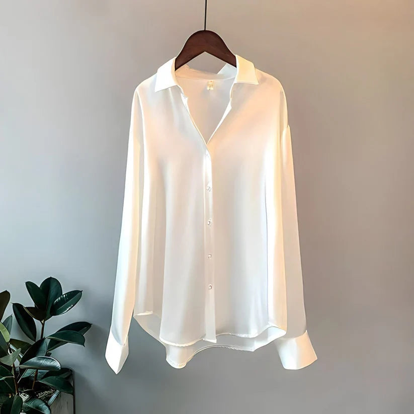 Elegant women's silk blouse with smooth texture; lightweight, versatile design in multiple colors. Perfect for any occasion.