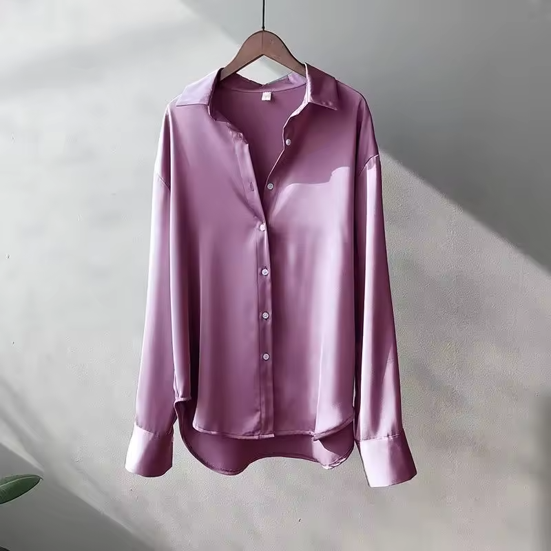 Elegant women's silk blouse with smooth texture; lightweight, versatile design in multiple colors. Perfect for any occasion.